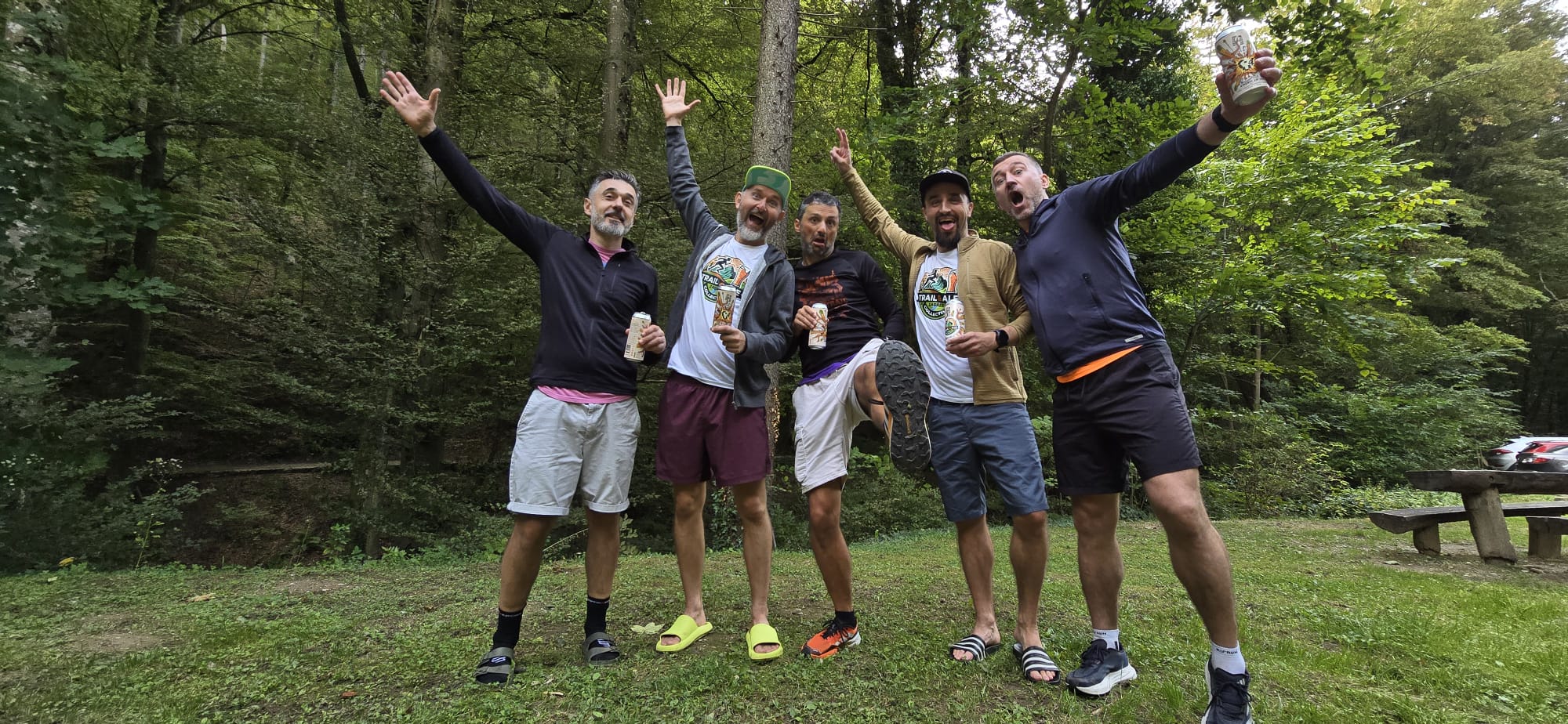 Trail & Ale crew sharing a laugh after a run in the woods